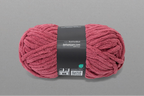 Pink skein of yarn with a label on a gray background