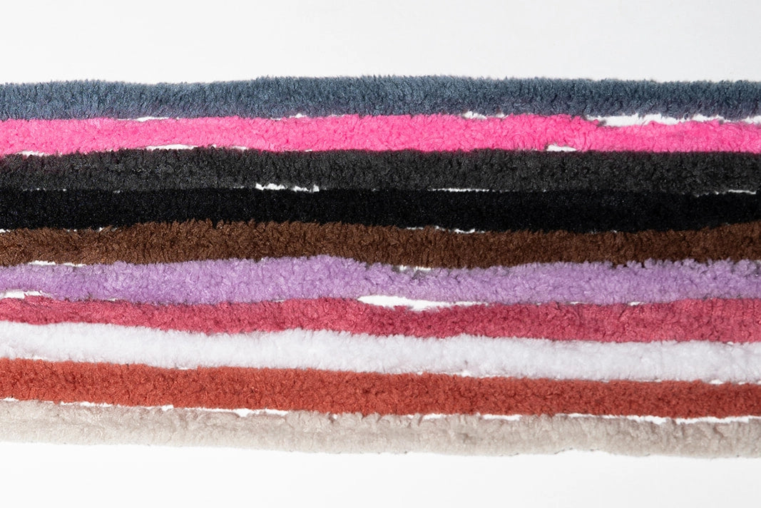 Close-up of colorful fabric strips on a white background