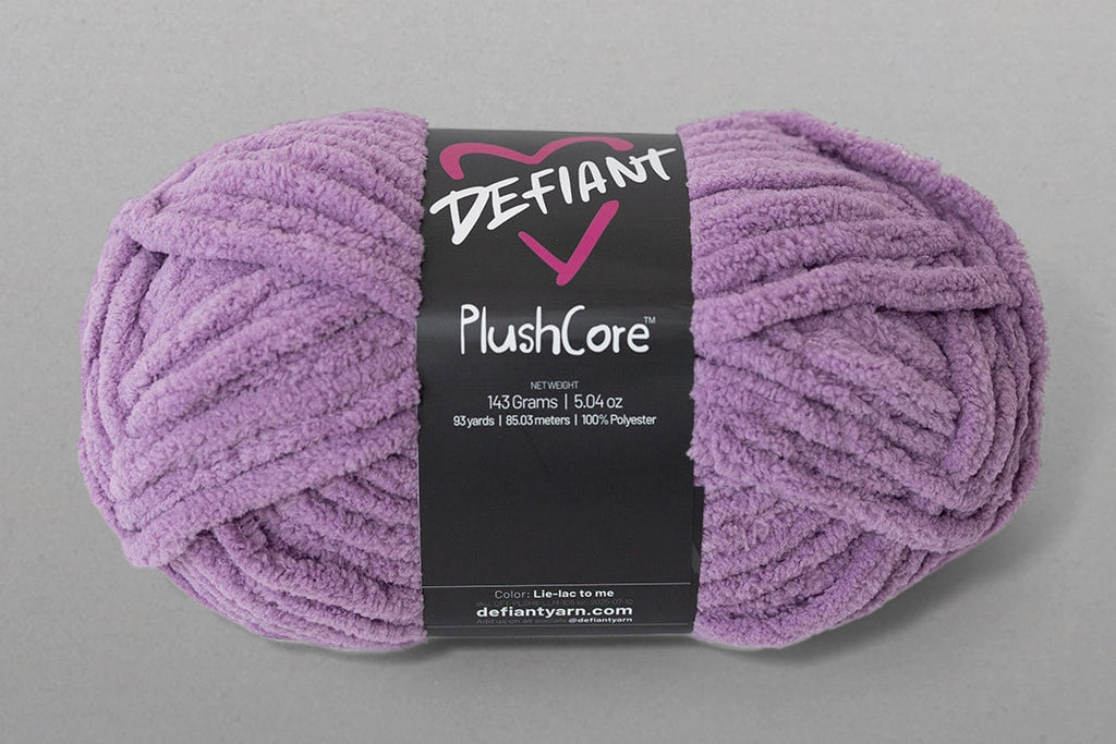 Purple skein of yarn with a Defiant label on a gray background