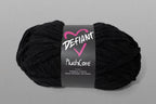 Black skein of yarn with a Defiant label on a gray background