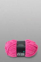 Pink yarn ball with a label on a gray background