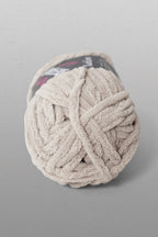 Ball of yarn on a gray background