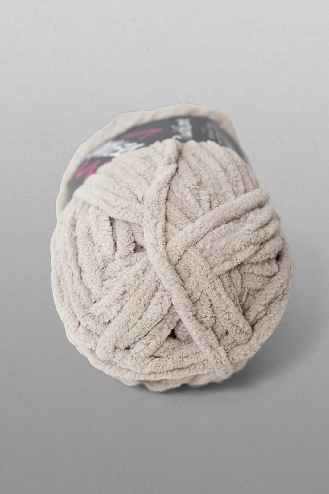 Ball of yarn on a gray background