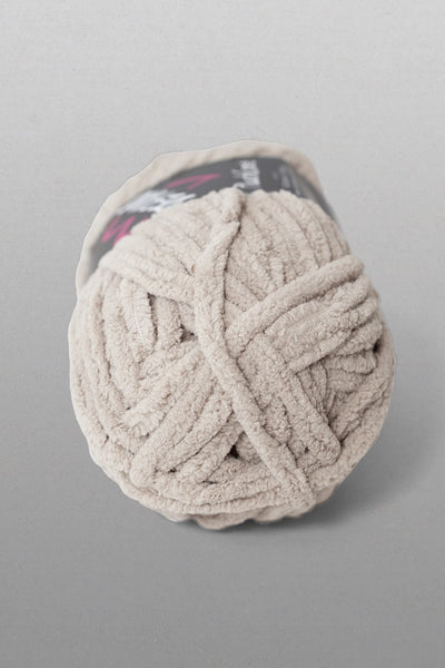 Ball of yarn on a gray background