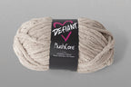 Ball of yarn with 'Defiant' label on a gray background