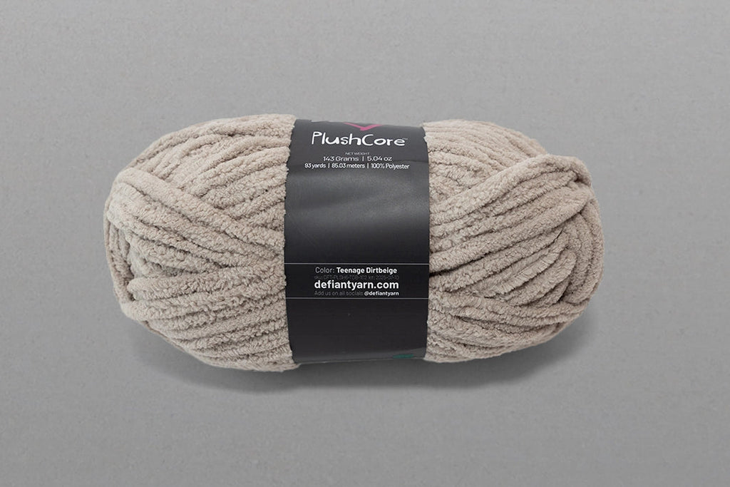 Ball of yarn with a label on a gray background